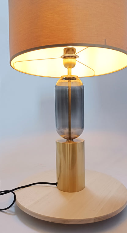 Base de lámpara en metal dorado y cristal gris.