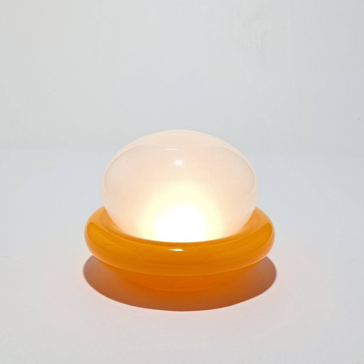 Cordless table lamp in orange glass, Nebulume model