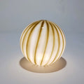 Cordless table lamp in olive-green striped opal glass, Ø 25 cm