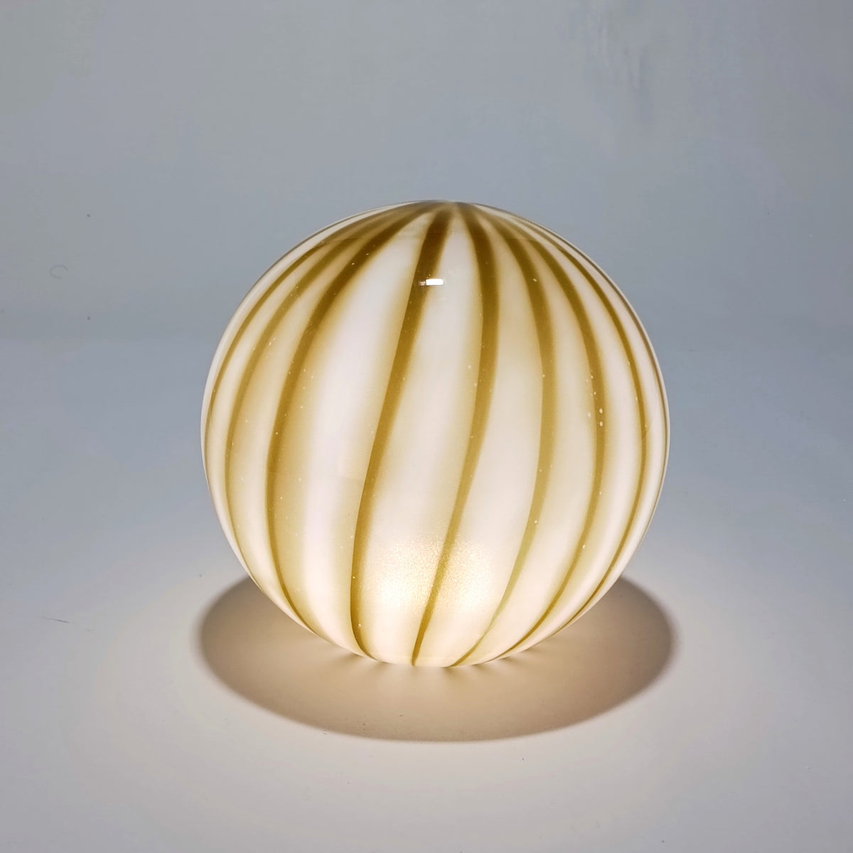Cordless table lamp in olive-green striped opal glass, Ø 25 cm