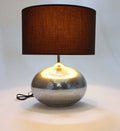 Table lamp in bubbled glass with a silver oval base